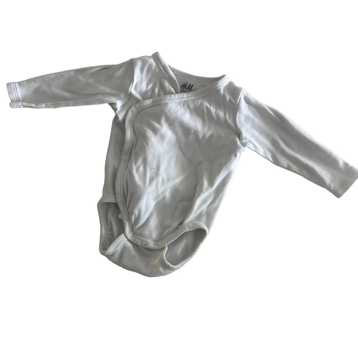 H&M Age 000 long sleeve wrap bodysuit in white with plain — gently loved condition.