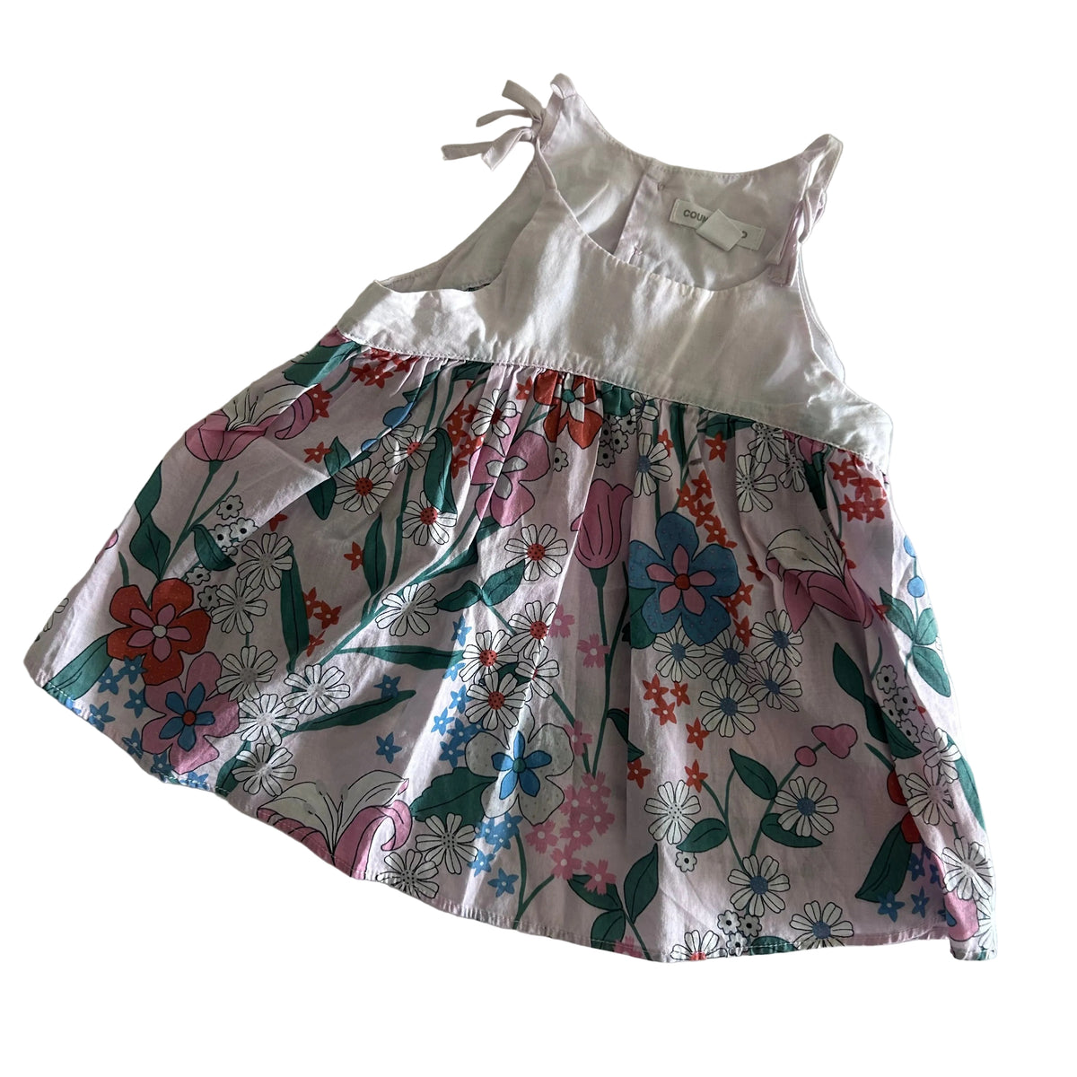 Country Road Age 1 sleeveless sundress with tie shoulders in white, pink, green, orange, blue with floral print skirt with plain white bodice — gently loved condition.