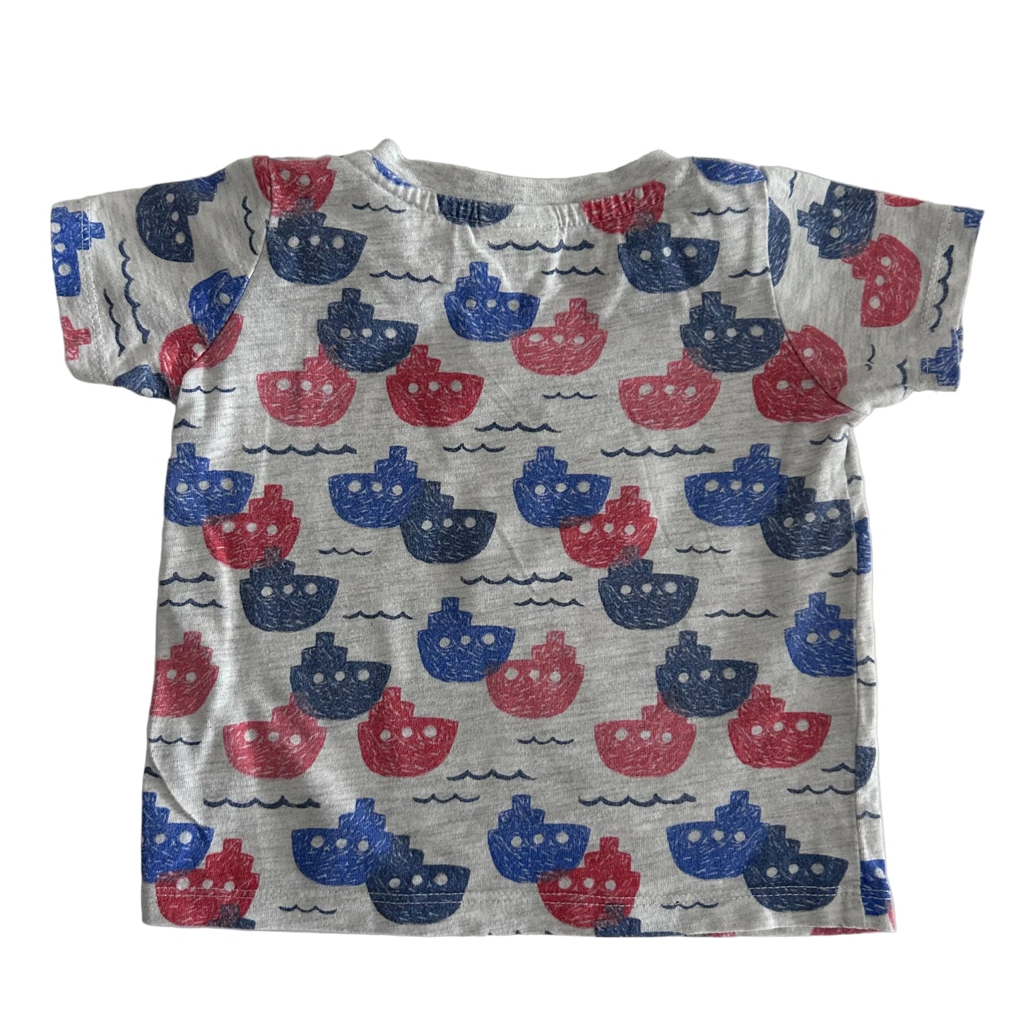 Baby's t-shirt with red and blue boat pattern on a white background