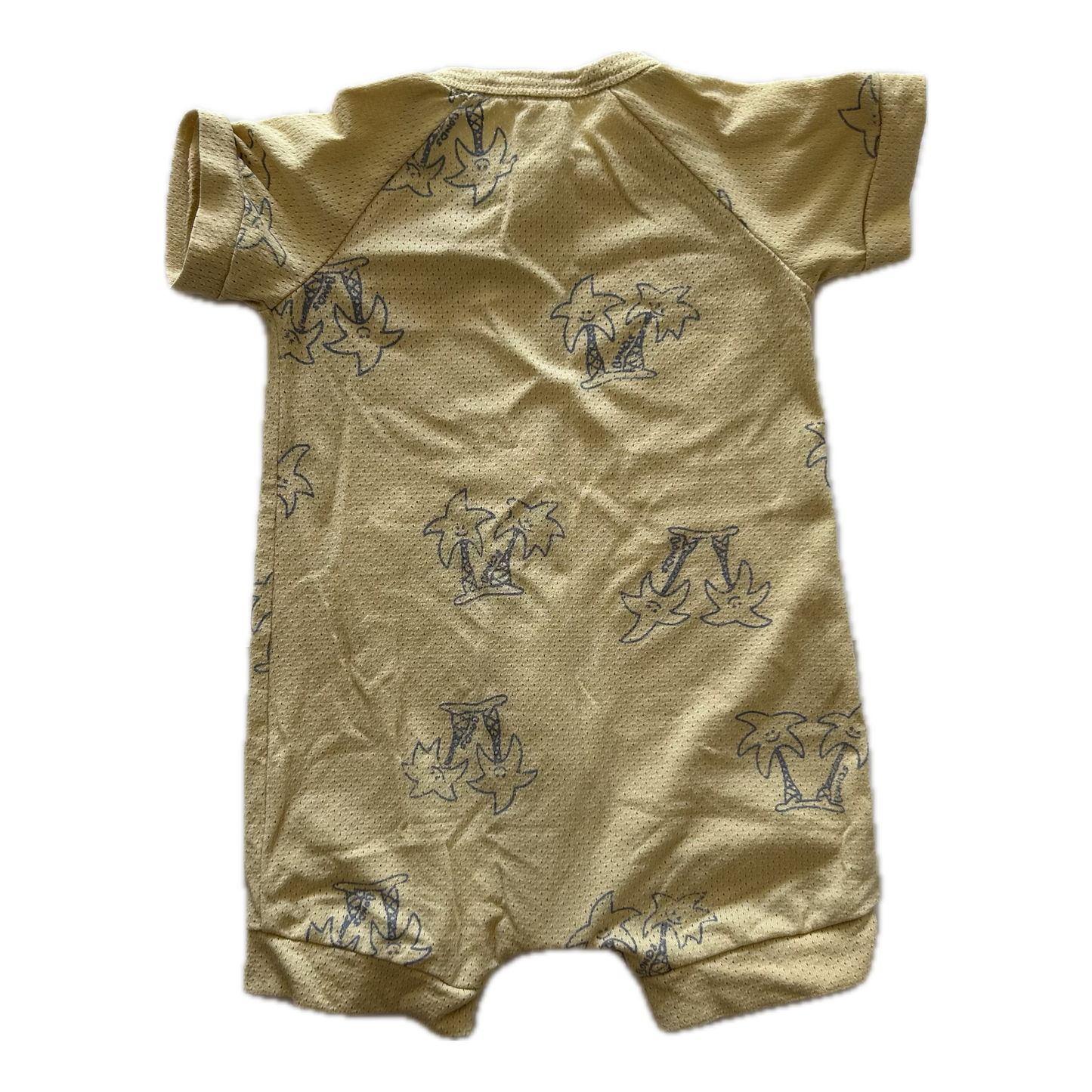 Mustard yellow baby romper with short sleeves and palm tree pattern on pale background