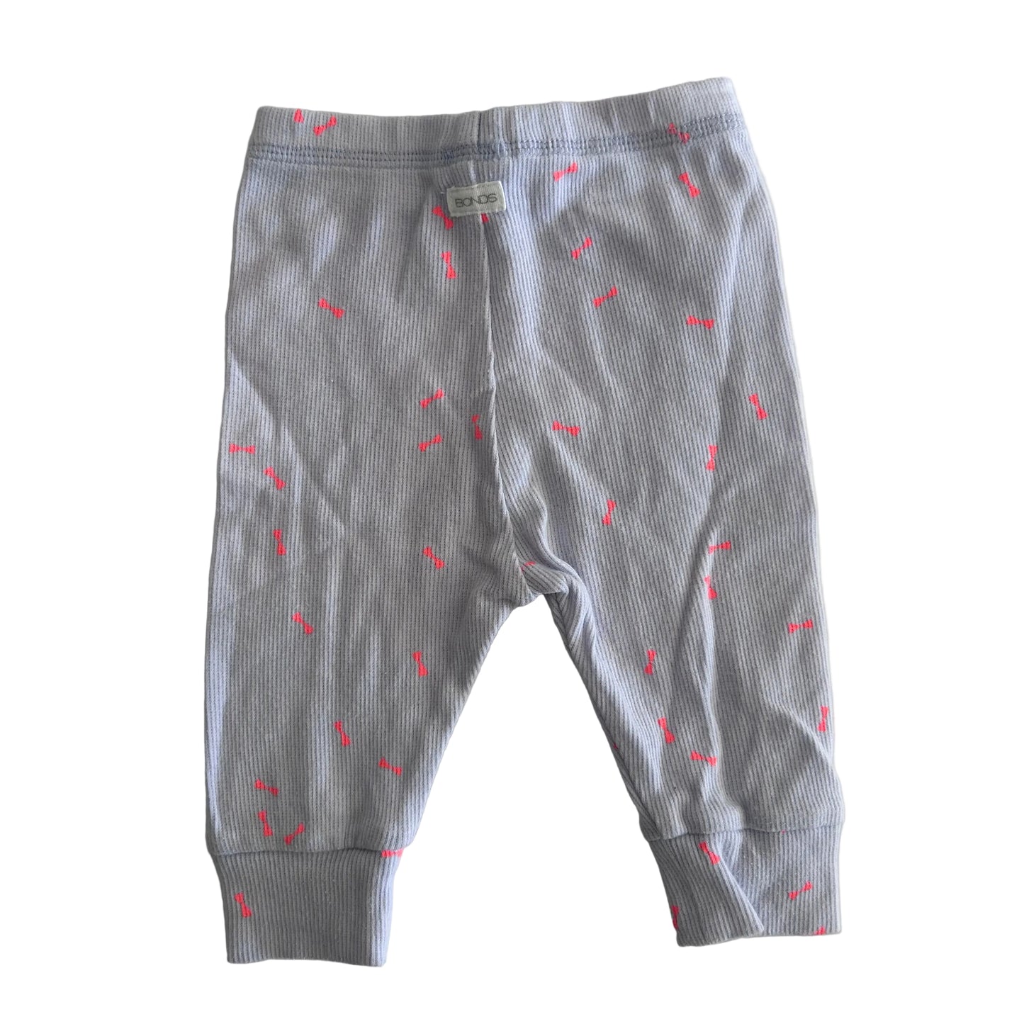 A pair of baby jogger pants in lilac ribbed fabric with small pink embroidered accents, laid flat on a light background.