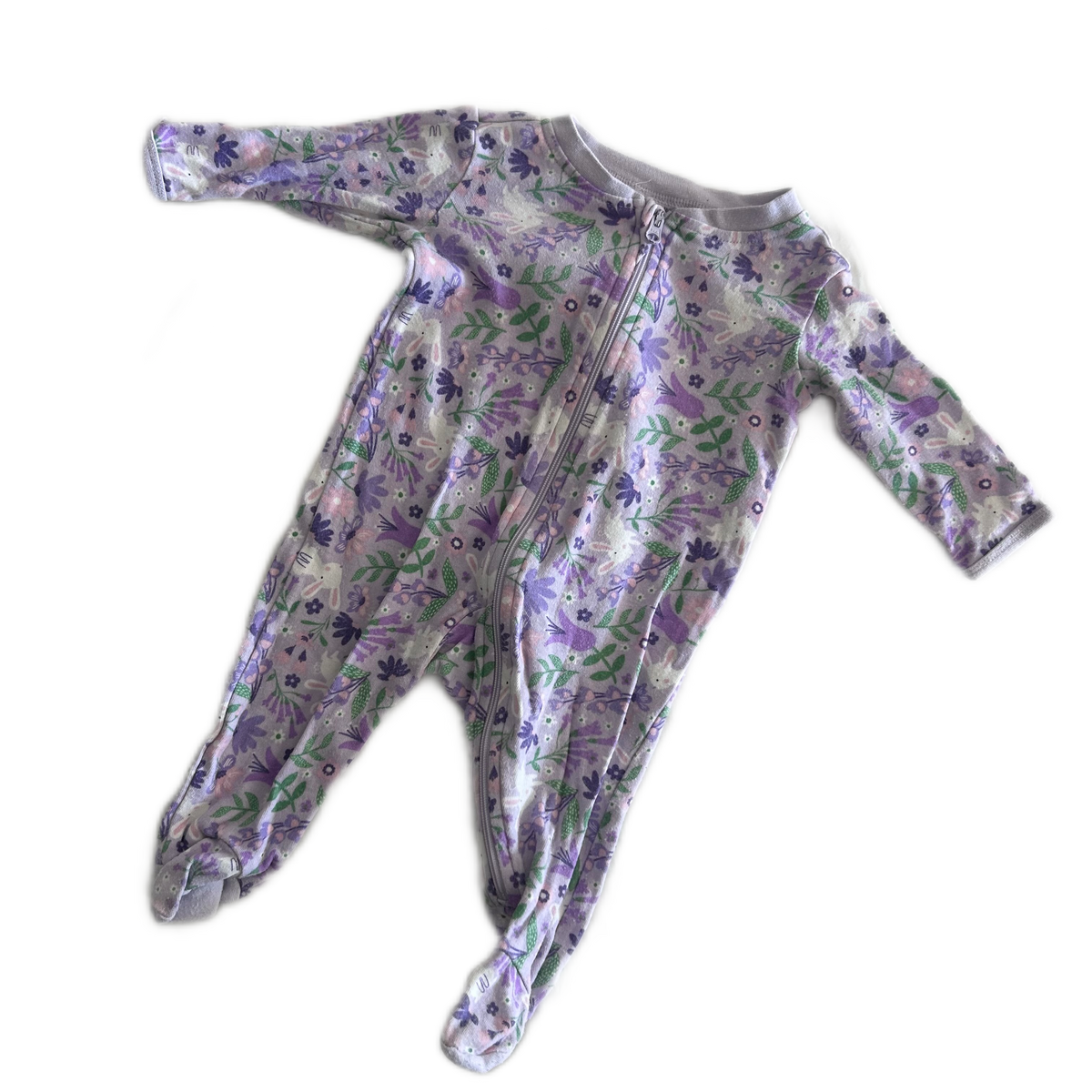 Anko Age 000 long sleeved zip footed sleepsuit in lavender, purple, green, pink, white with floral and bunny print — gently loved condition.