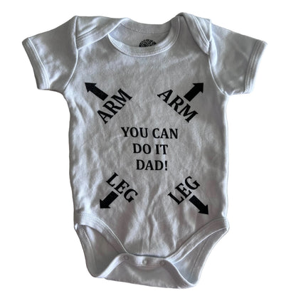 Robin Armin Age 0 short sleeve bodysuit in white with novelty print with arrows and text reading 'arm arm leg leg you can do it dad!' — like new condition.