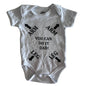 Robin Armin Age 0 short sleeve bodysuit in white with novelty print with arrows and text reading 'arm arm leg leg you can do it dad!' — like new condition.