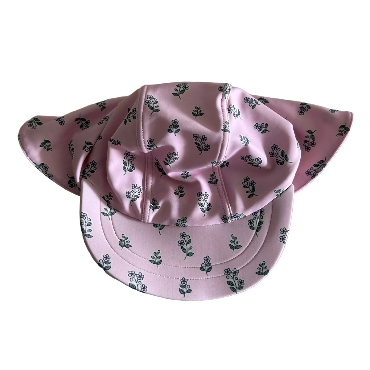 Target Age 00 baby sun hat with wide brim and neck flap in pink with small floral print (flowers and leaves in dark green/grey on pink) — like new condition.