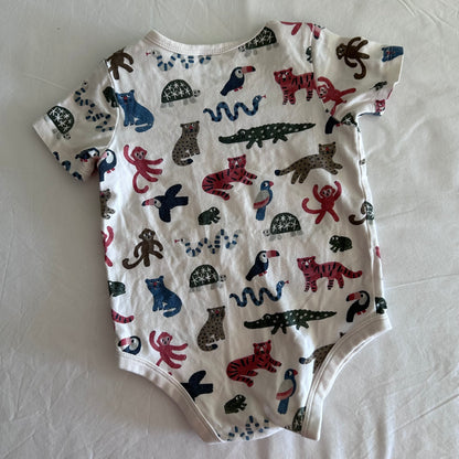 Target Age 0 short sleeve bodysuit in white, multicolour with allover jungle animal print (tigers, monkeys, toucans, crocodiles, snakes, turtles, leopards) — like new condition.