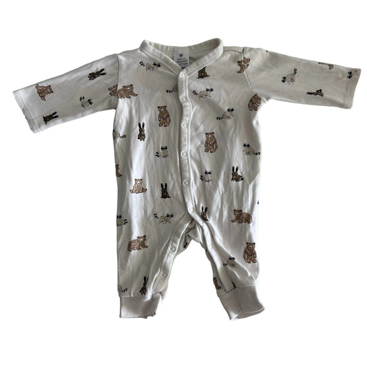 Target Age 000 long sleeve snap-front footed romper in white/cream with woodland animals allover print (bears, raccoons, rabbits) — gently loved condition.