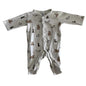 Target Age 000 long sleeve snap-front footed romper in white/cream with woodland animals allover print (bears, raccoons, rabbits) — gently loved condition.
