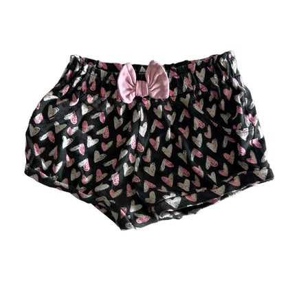 Baby Berry Age 00 shorts in dark charcoal grey, pink, white with all-over heart print, pink bow detail at front waistband — gently loved condition.