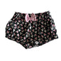 Baby Berry Age 00 shorts in dark charcoal grey, pink, white with all-over heart print, pink bow detail at front waistband — gently loved condition.