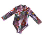 Mini Mango Age 1 long sleeved zip-up one piece swimsuit in white, purple, pink, orange, teal, yellow with retro daisy floral print — gently loved condition.