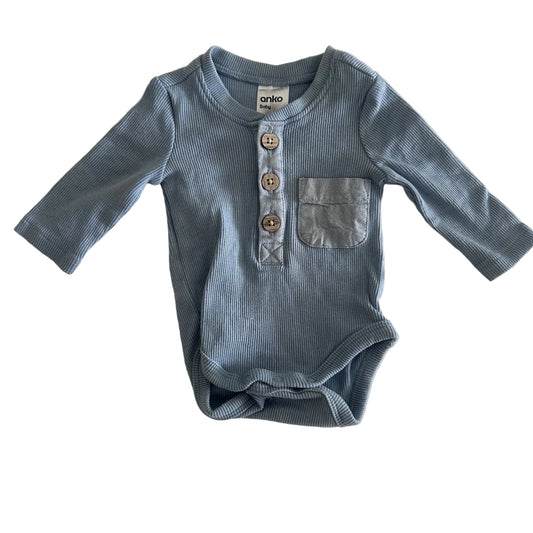 Anko Age 0000 long sleeve henley bodysuit in light blue with ribbed texture, chest pocket, wooden buttons — gently loved condition.