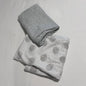 Dymples 000, 00, 0 - ideal for a range of ages swaddle in white, grey with large grey watercolour spots with small black dots on sheet; plain grey on second piece — gently loved condition.