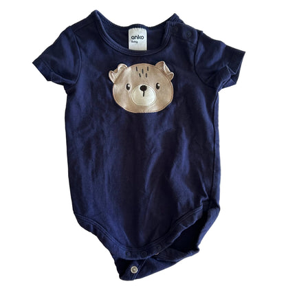 Anko Baby Age 00 short sleeve bodysuit in navy blue with embroidered bear face appliqué on chest — gently loved condition.