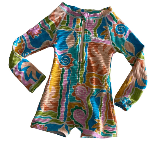 Billabong Age 1 long sleeve zip-up rashie swimsuit in blue, teal, pink, orange, yellow, green, white with abstract tropical floral and swirl print — gently loved condition.