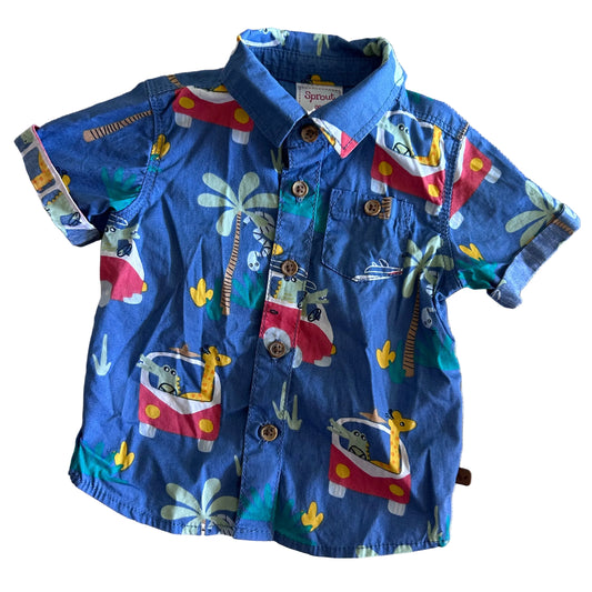 Sprout Age 000 short sleeved button up shirt in blue, red, yellow, green, white with tropical print with giraffes, crocodiles, palm trees and retro campervans — like new condition.