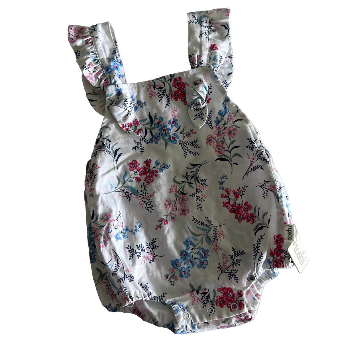 Toshi Age 1 sleeveless flutter sleeve bubble romper in white, pink, red, blue, green, navy with floral print with scattered flower clusters and leaf sprigs — new condition.