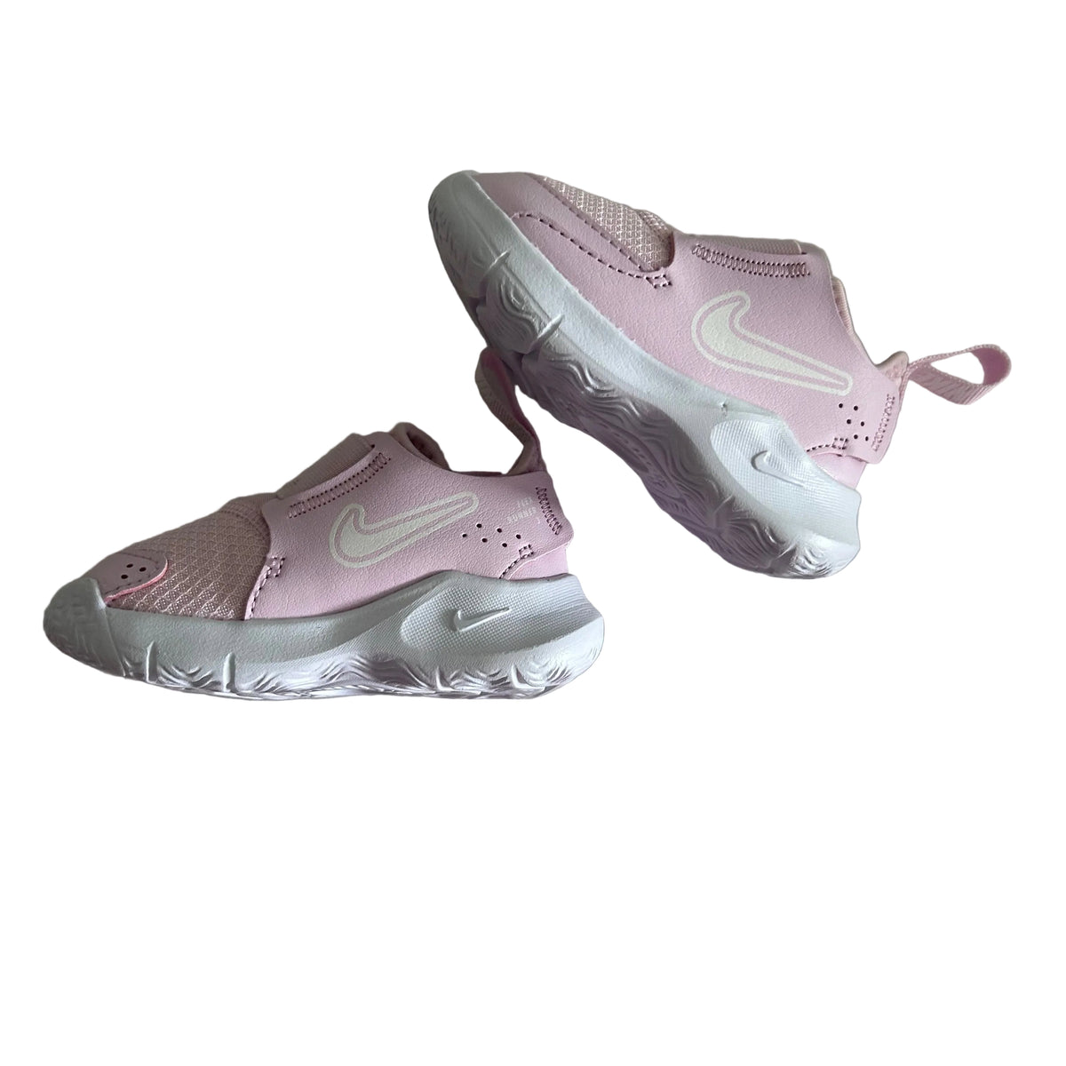 Nike 10cm | EUR 19.5 slip-on sneakers with velcro strap in pink and white with tonal nike swoosh logo, perforated detailing, swirl pattern on sole — like new condition.