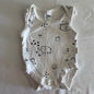 Anko Baby Age 00000 sleeveless bodysuit in white with black print with allover illustrated print featuring elephants, castles, houses, rainbows, arrows, dots and small plants — gently loved condition.