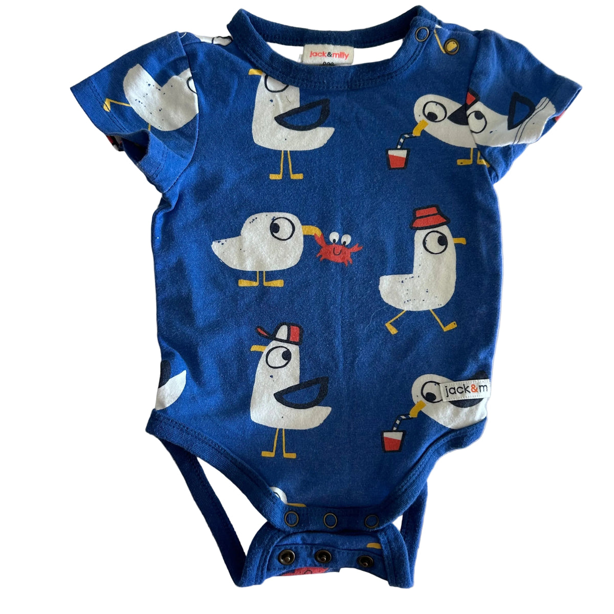 Jack & Milly Age 000 short sleeve bodysuit in royal blue, white, yellow, red with cartoon seagulls with crabs and drink cups allover print — gently loved condition.