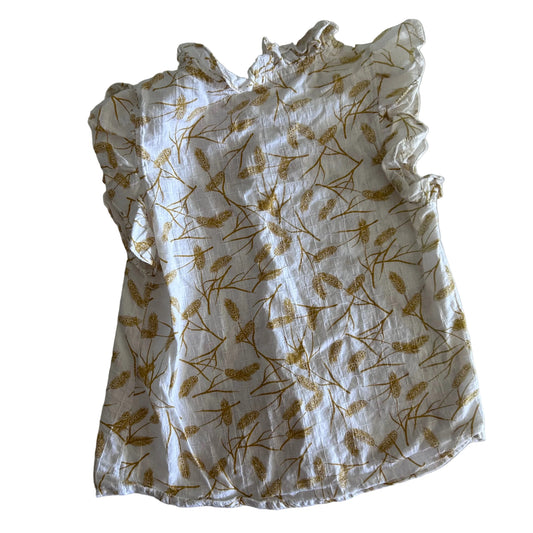 Age 7 short sleeve button-up top with ruffle collar and bow detail in white and mustard yellow with scattered pine branch and feather print, ruffle collar trim, mustard yellow fabric bow at chest — gently loved condition.