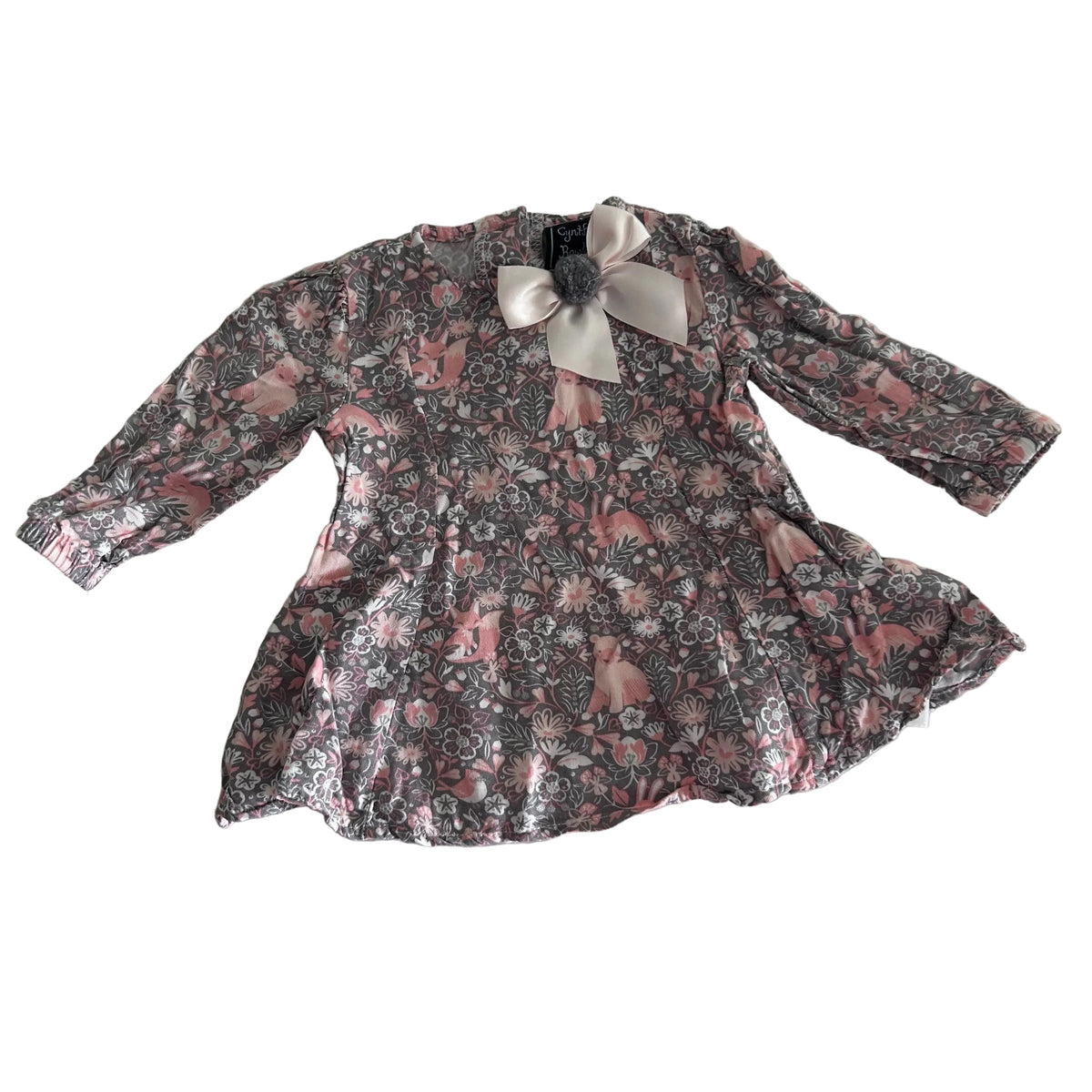 Cynthia Rowley Age 000 long sleeved floral dress with bow detail in grey, pink, white with floral and woodland animals print, satin bow with grey pom pom at neckline, lettuce edge trim — gently loved condition.