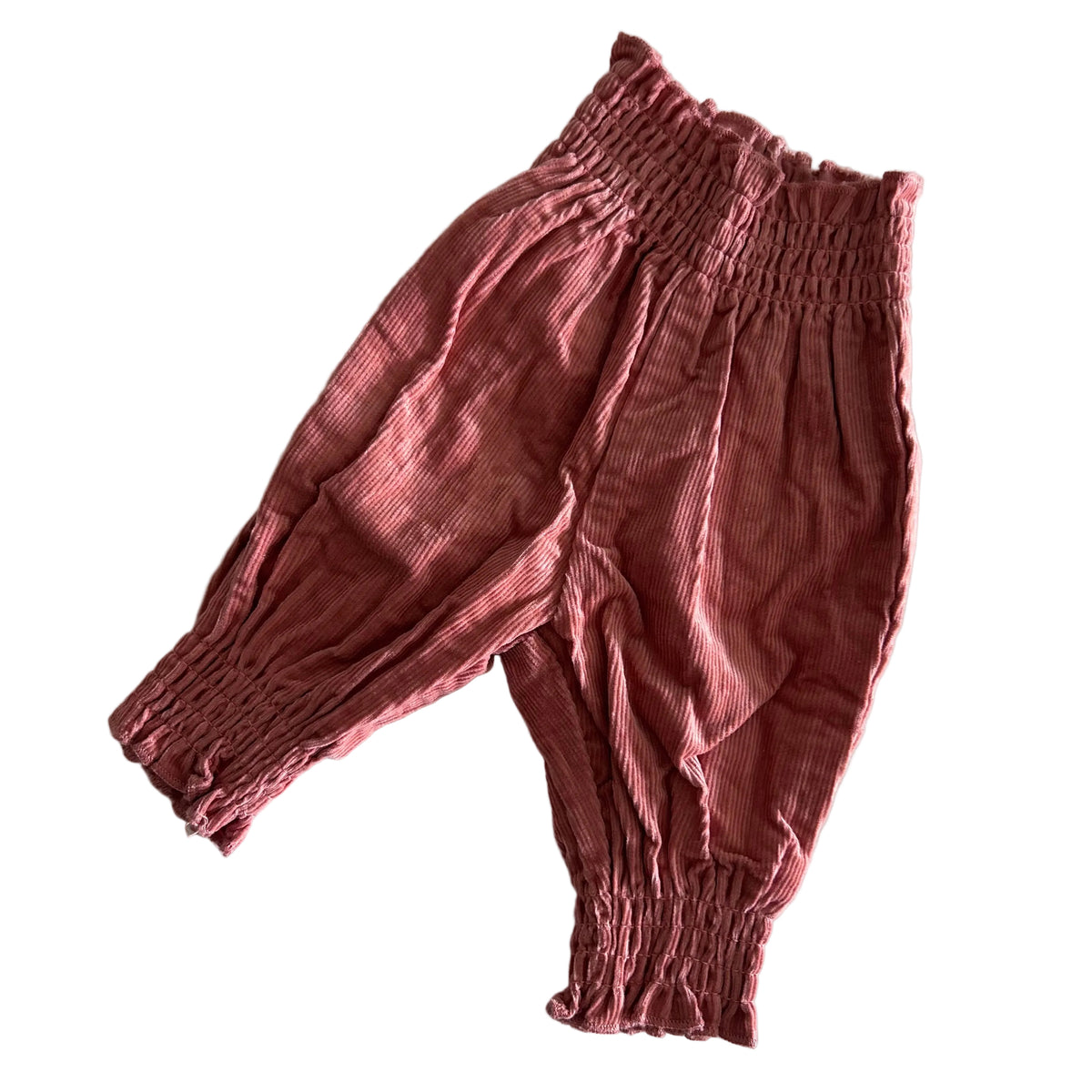 Baby Berry Age 0000 harem pants in dusty pink with ribbed texture, smocked waistband and cuffs — gently loved condition.