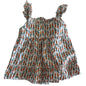 Mini Kids Age 7 sleeveless tiered ruffle top in white, orange, green with allover carrot print — gently loved condition.