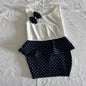 Unknown (no label) Age 1 sleeveless dress in white and navy with polka dot on navy sections, navy polka dot bow embellishment on chest — gently loved condition.