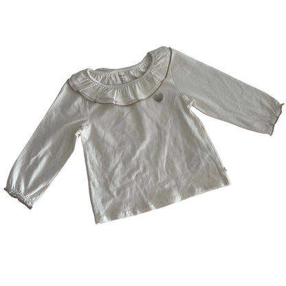 Obaïbi Age 2 long sleeved ruffle collar top in white with gold/taupe embroidery detail with ruffle collar with metallic trim and small embroidered seashell motif — like new condition.