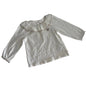 Obaïbi Age 2 long sleeved ruffle collar top in white with gold/taupe embroidery detail with ruffle collar with metallic trim and small embroidered seashell motif — like new condition.
