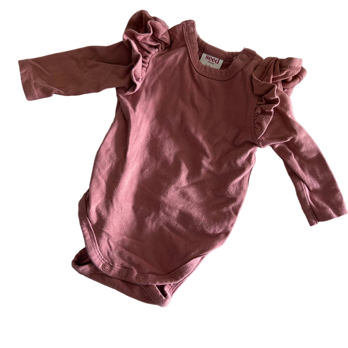 Seed Heritage Age 0000 long sleeve frill shoulder bodysuit in dusty pink with frill/ruffle detail at shoulders — gently loved condition.