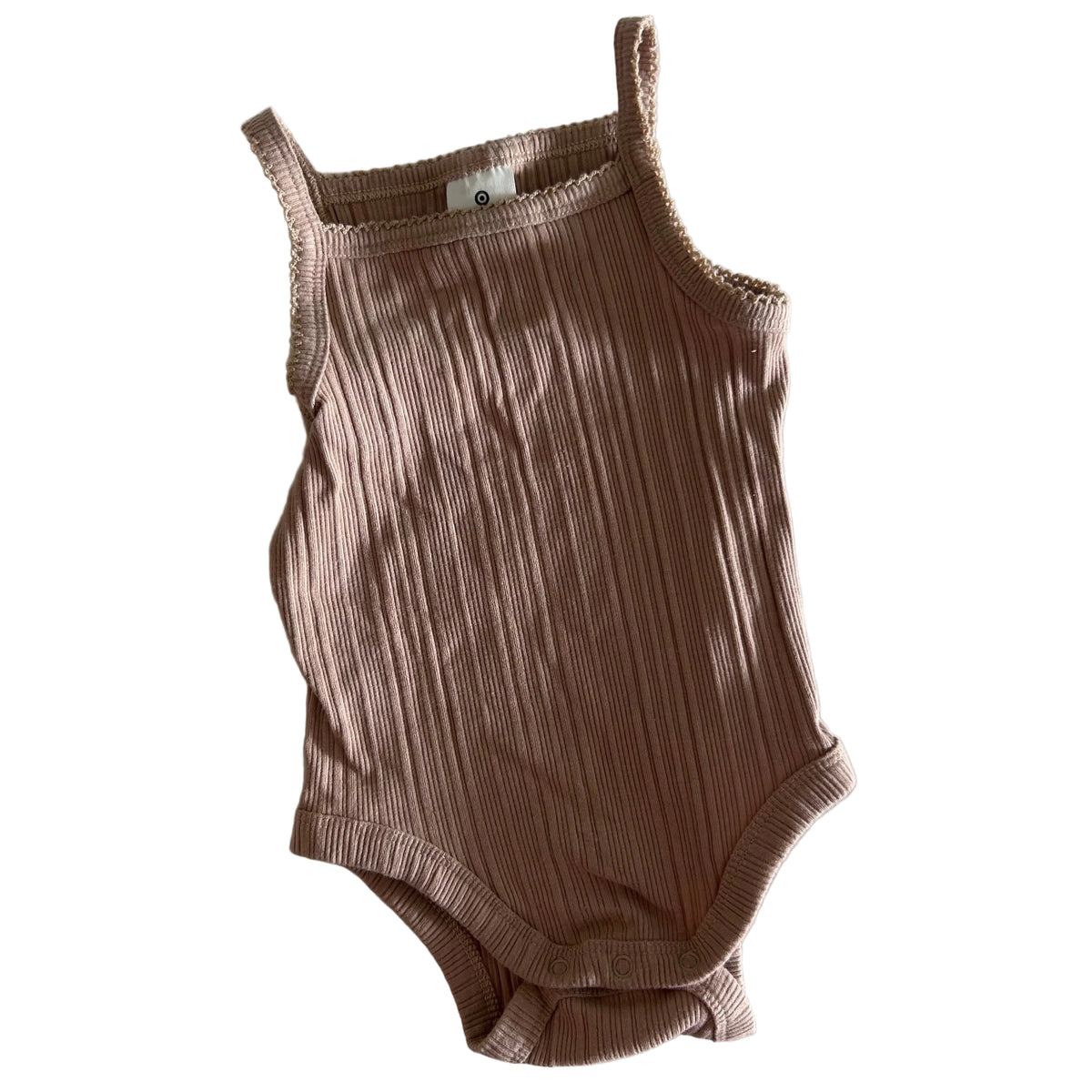 Target Age 00 sleeveless ribbed bodysuit in dusty pink/tan with ribbed knit with lettuce hem edging — gently loved condition.