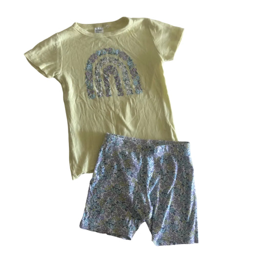 Anko Age 4 short sleeve pyjama set (top and shorts) in yellow, white, pastel blue, lilac, pink with floral rainbow graphic on top; all-over ditsy floral print on shorts — gently loved condition.
