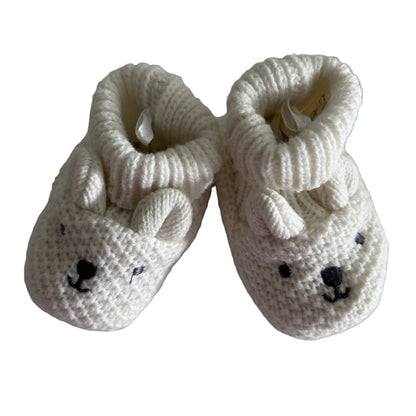 Unknown 13cm knitted baby booties in cream/off-white with bear face embroidered on toe, small ears detail, ribbed cuff — gently loved condition.