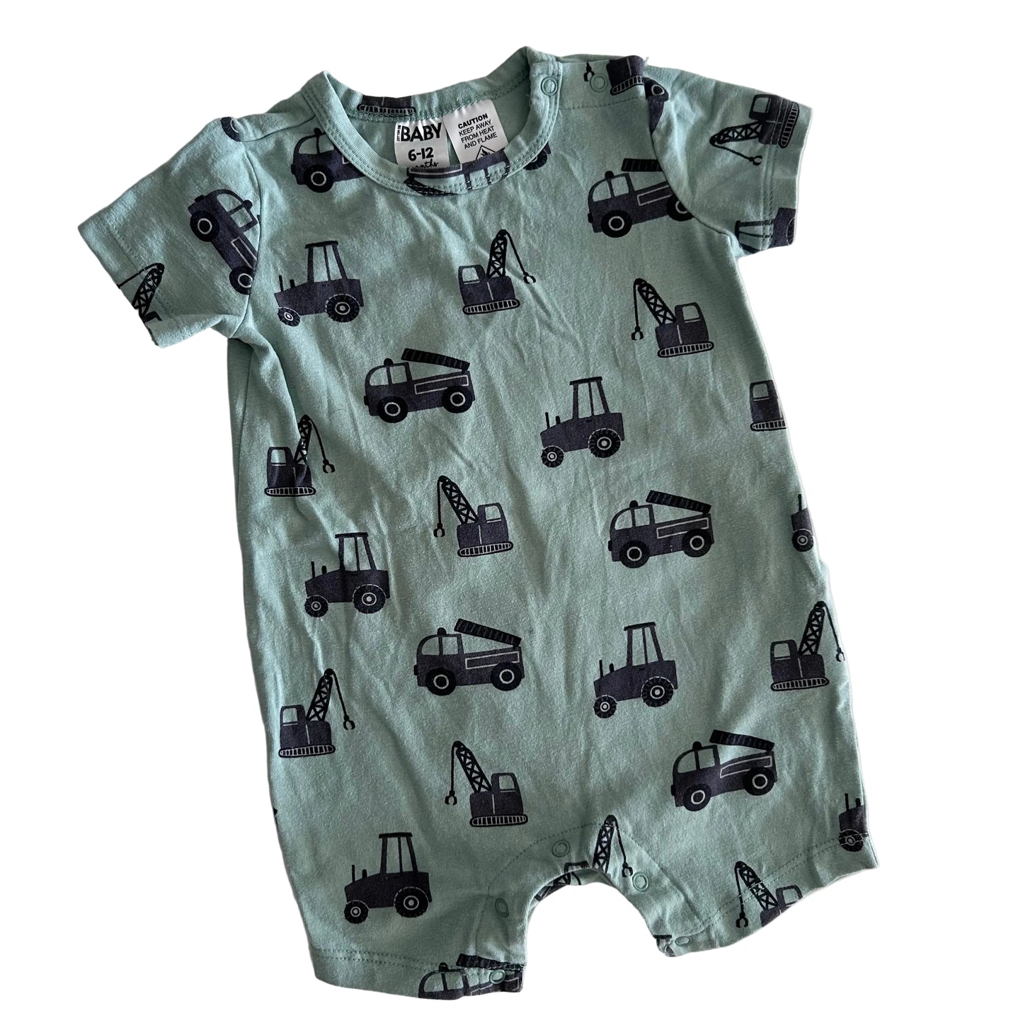 Green baby romper with black vehicle patterns on a white background