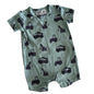 Green baby romper with black vehicle patterns on a white background