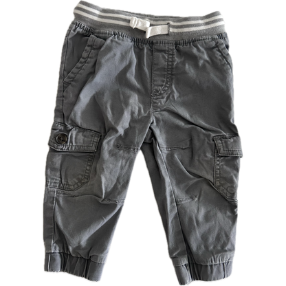 Gray cargo trousers with a striped waistband on a white background