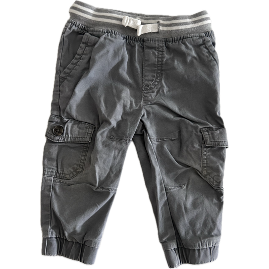 Gray cargo trousers with a striped waistband on a white background