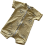 Mustard yellow baby romper with short sleeves and palm tree pattern on pale background
