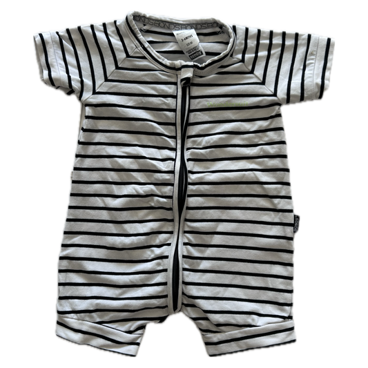White and black stripey baby romper on pale backround