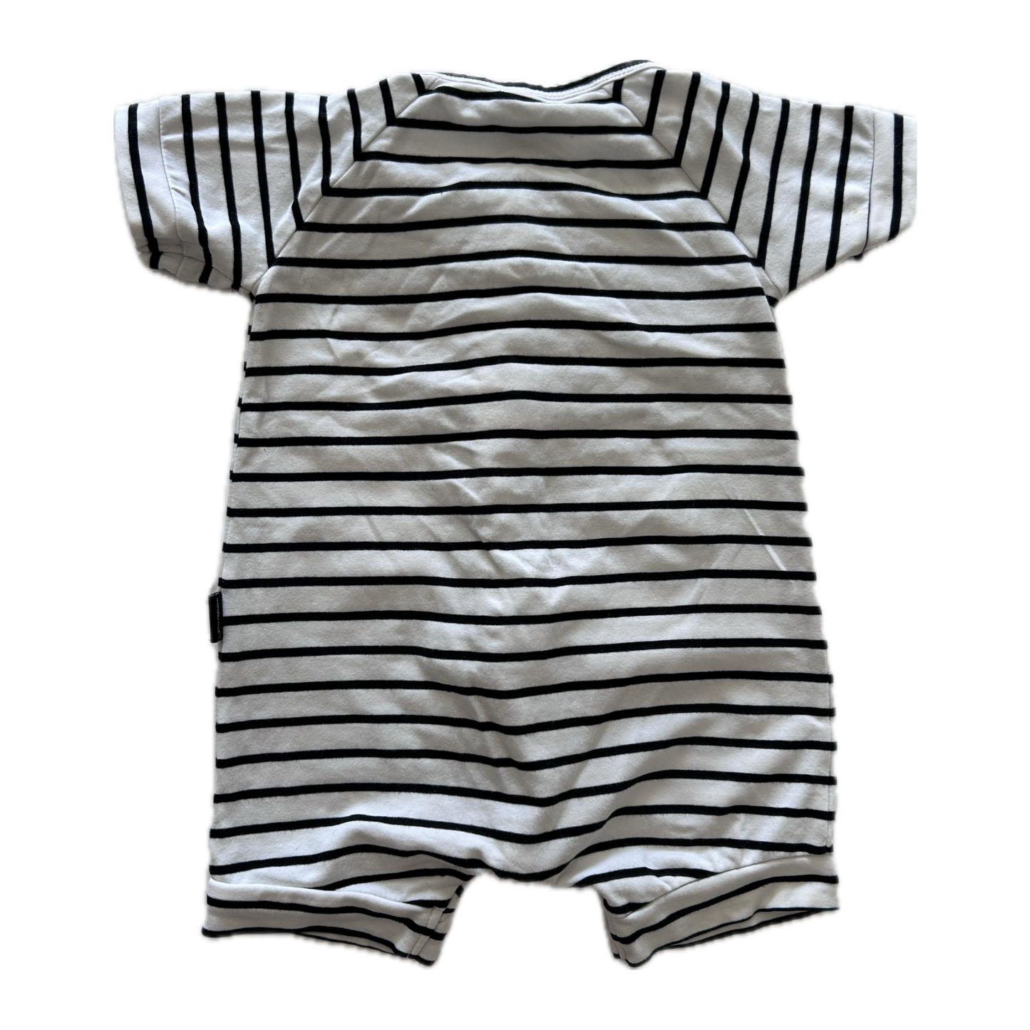 White and black stripey baby romper on pale background