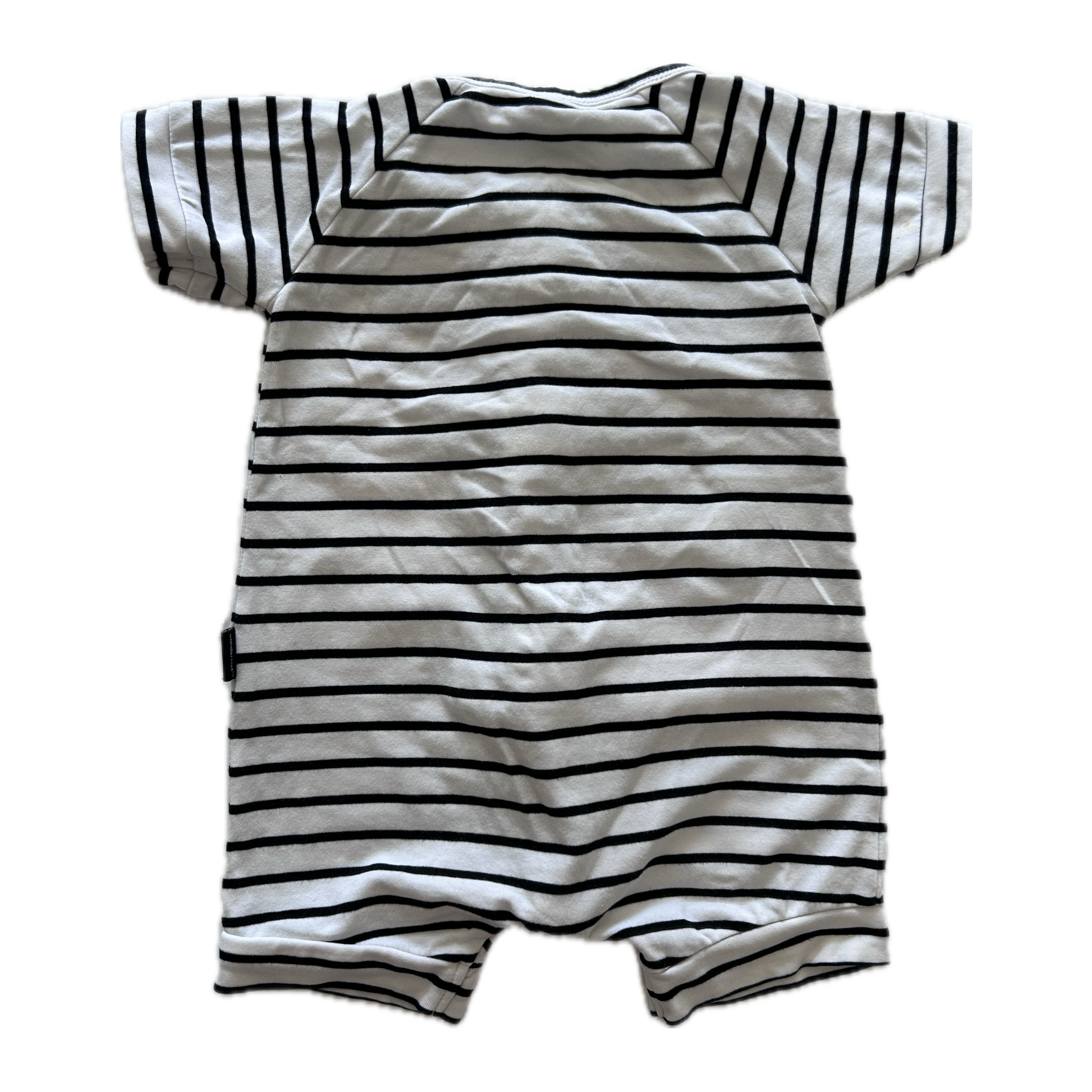 White and black stripey baby romper on pale background