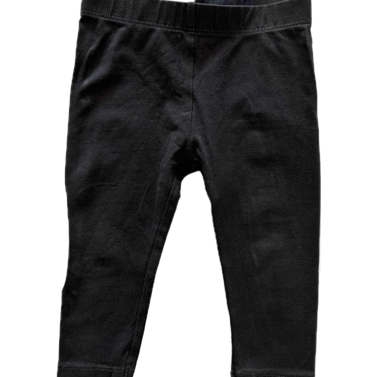 Black cotton leggings for toddlers, featuring an elastic waistband and ribbed ankle cuffs, shown flat against a white background