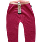A pair of infant leggings in a bright pink color, featuring a contrasting light pink waistband and a hanging Bonds brand tag