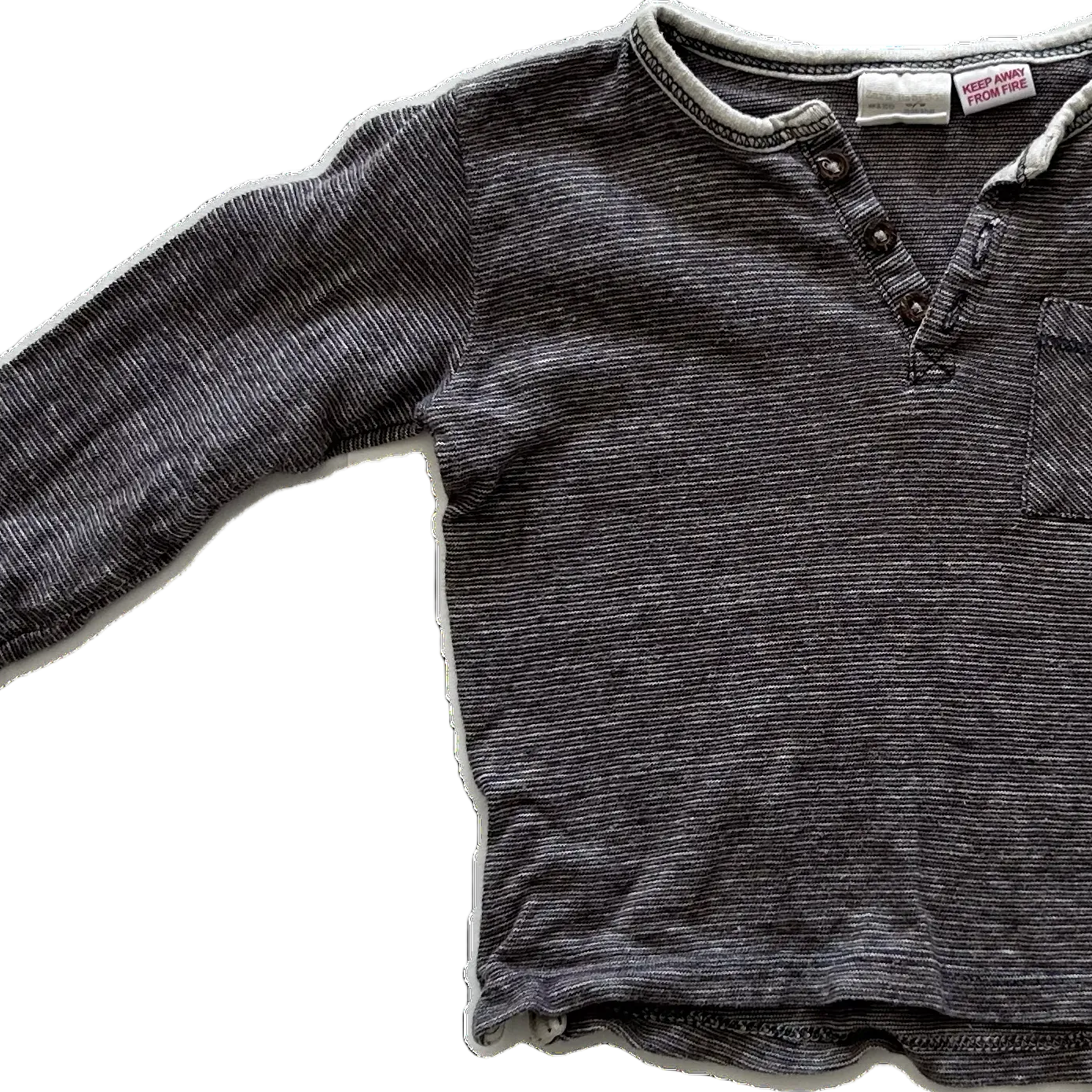 A dark gray-brown ribbed knit long-sleeve shirt with a three-button placket and a chest pocket, laid flat against a white background.