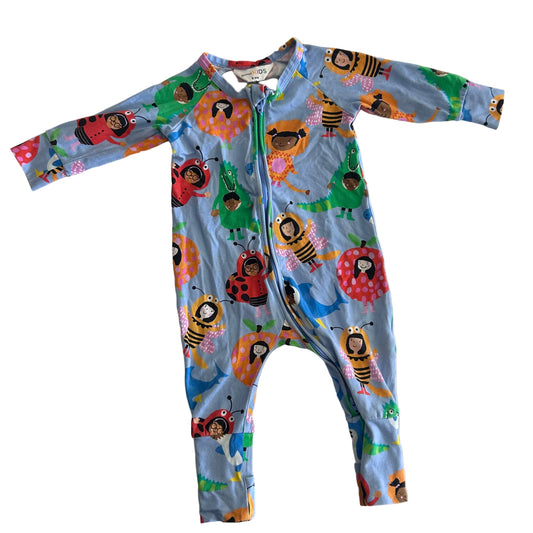 A baby's long-sleeve zip-up one-piece romper in light blue, featuring a colorful cartoon print of ladybugs, bees, flowers, and children, laid flat on a white background.
