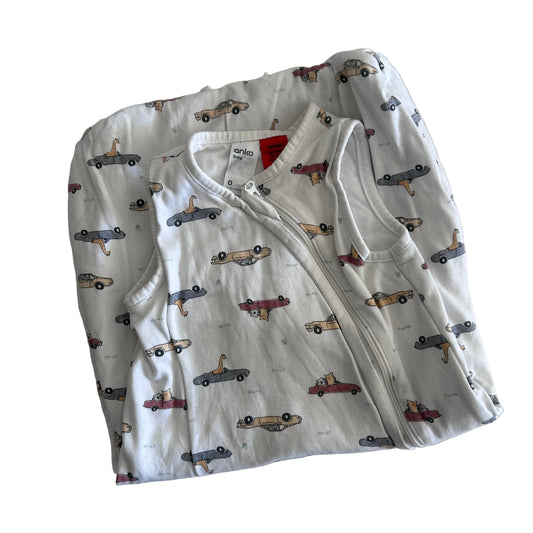 A folded baby sleep sack with a white background and an all-over car print, featuring a front zipper closure and a visible 'anko' brand label.