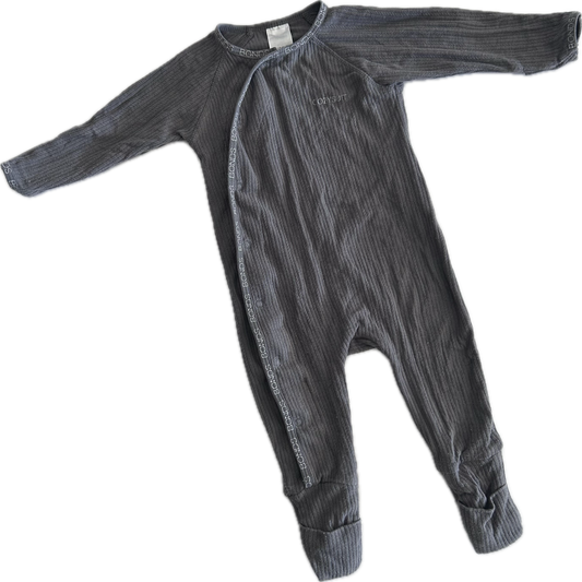 A dark gray ribbed baby romper with long sleeves and footed legs, laid flat on a white background.