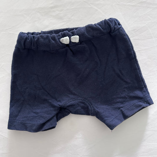 Navy blue baby shorts with white drawstring on white background.